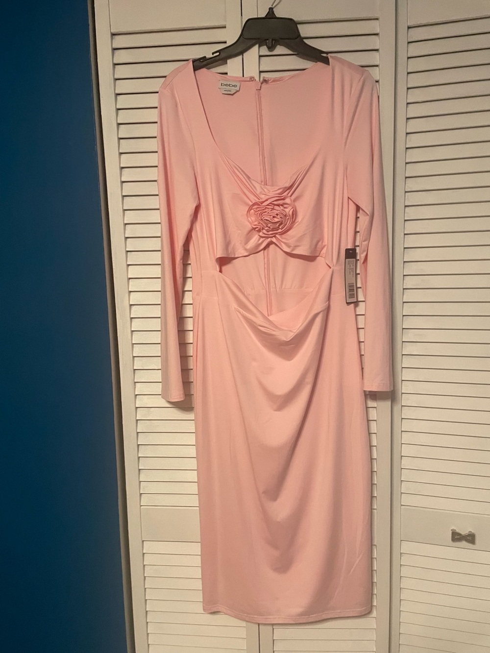Bebe Pink Long Sleeve Elegant  Dress says “too hot for you” cutout at mid area.